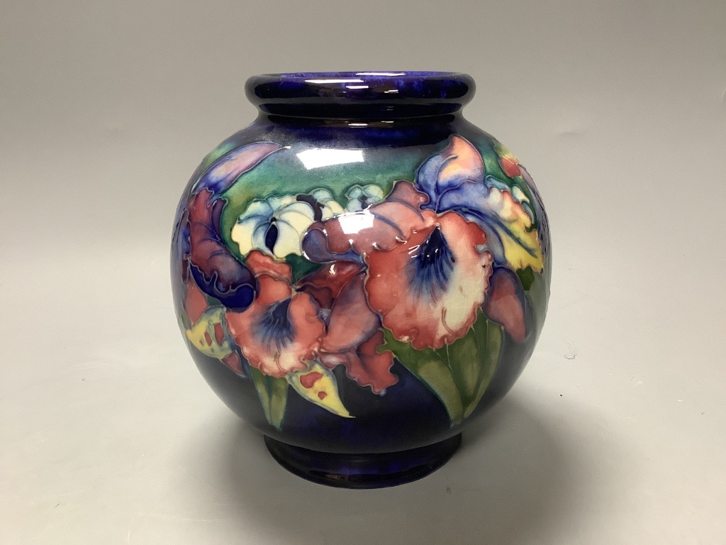 A Moorcroft blue ground bulbous Orchid pattern vase, H 15cm